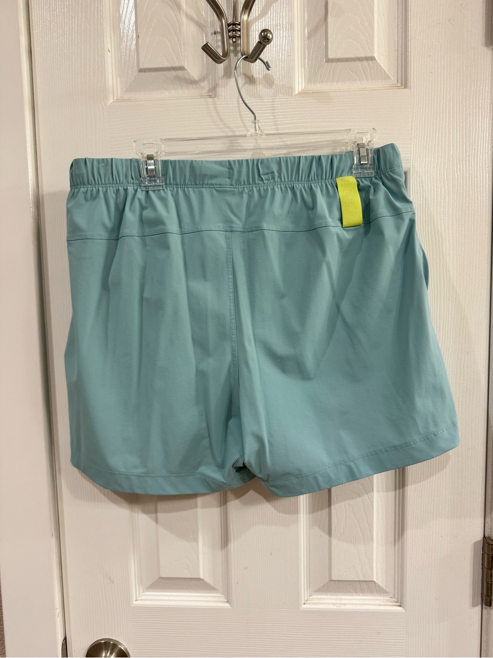 Fabletics Light Teal Athletic Shorts with Neon Yellow Accents - Picture 7 of 9